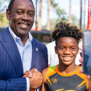 Mayor Demings with a young resident of Orange County at an event.