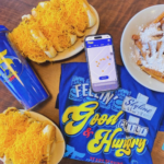 a variety of gifts and food items from skyline chili: coney dogs, a water cup, funnel fries and a t shirt 