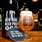 growler of beer, mug of beer and branded coaster from new york beer project in horizon west